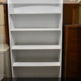 F53. White painted bookcase. 